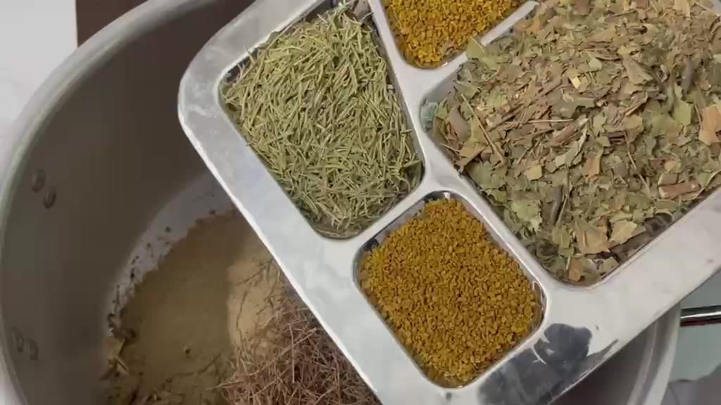 Whole herbs measured out on a tray before blending